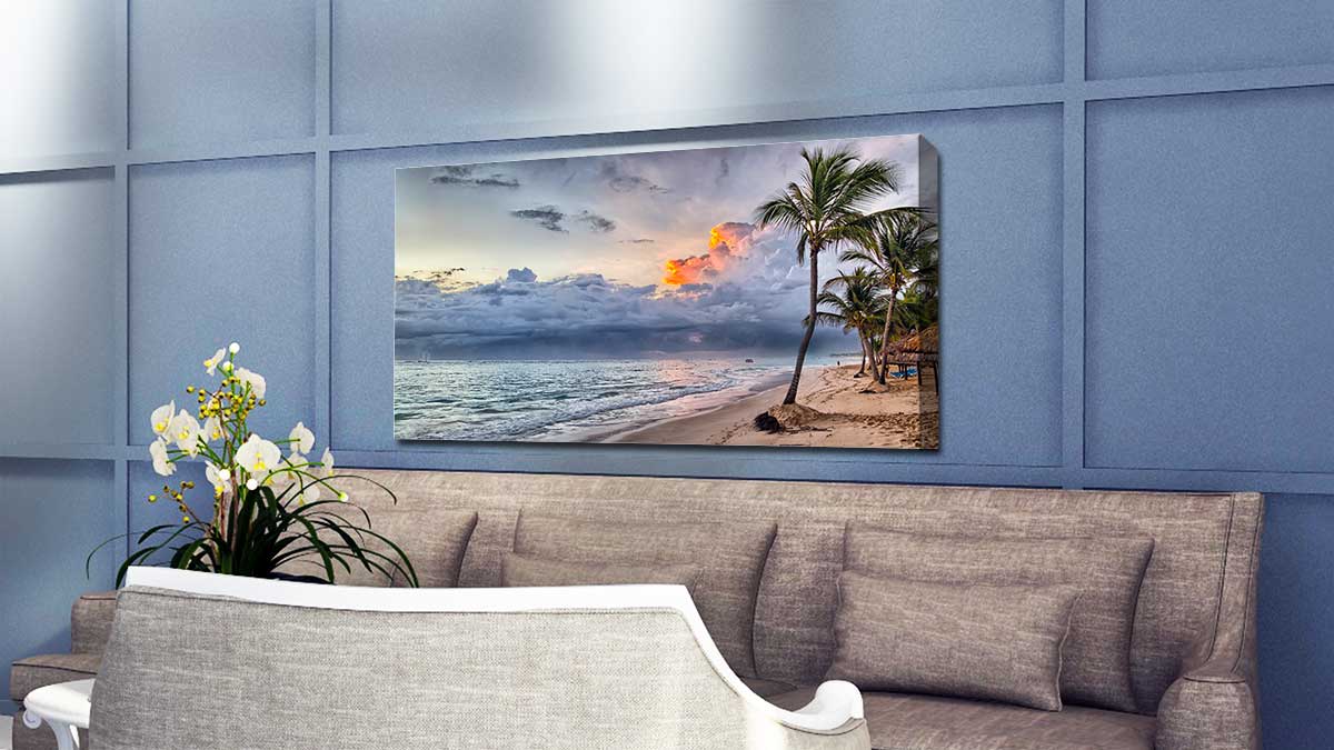 Picture of a tropical beach printed on canvas and hung in a sitting room