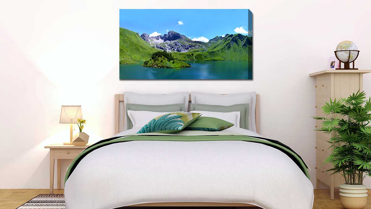 Beautiful landscape of a lake with hills behind hung over a double bed