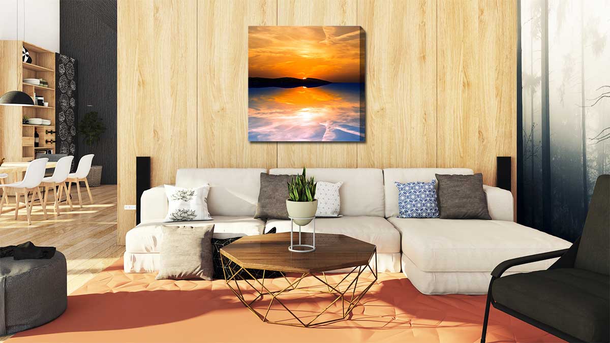 Picture of stunning sunsets on canvas displayed over a cream coloured settee