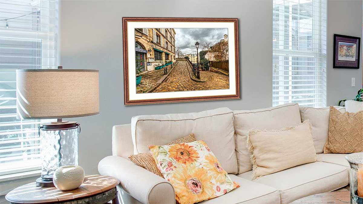 Photo taken on a city break, framed in our walnut stained frame with gold sight edge. Hung in a very traditional sitting room with a cream sofa and fluffy cushions