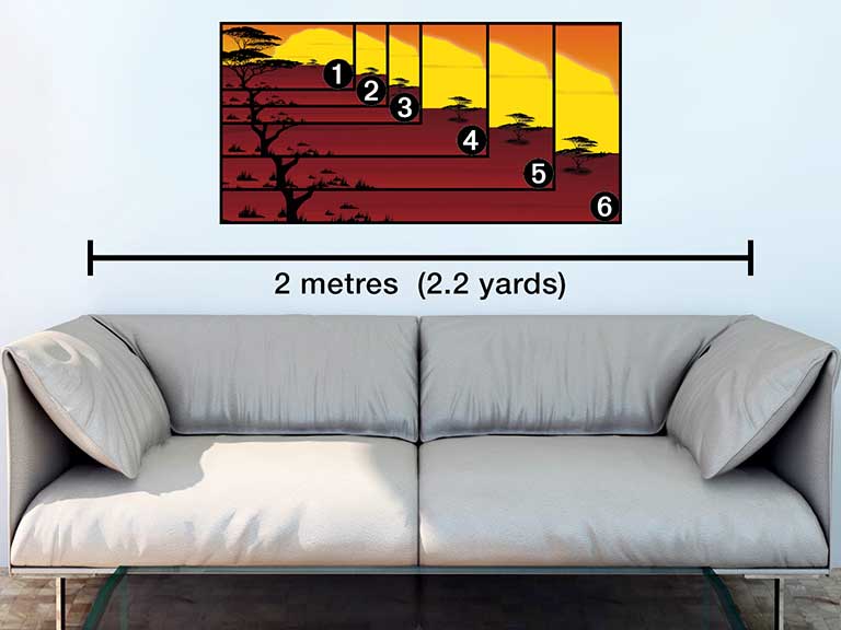 Image of panoramic photo prints hanging above a sofa with sizes