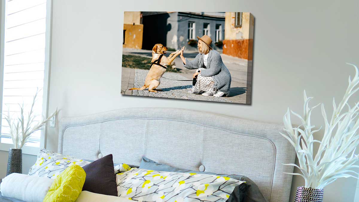 Canvas print on a bedroom wall featuring a photo of a family walk