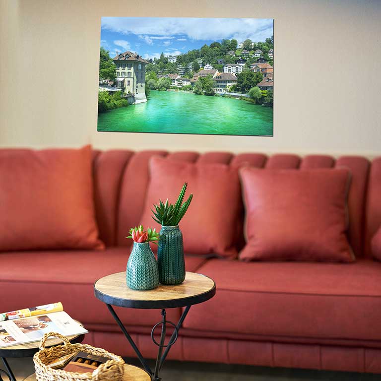 Poster of a holiday picture from a trip to Europe featuring a beautifully blue river hanging in a sitting room