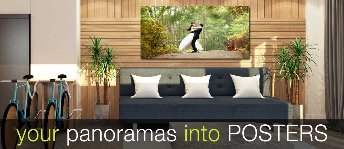 Panoramic wedding picture printed to a large poster and hung on a wall above a settee