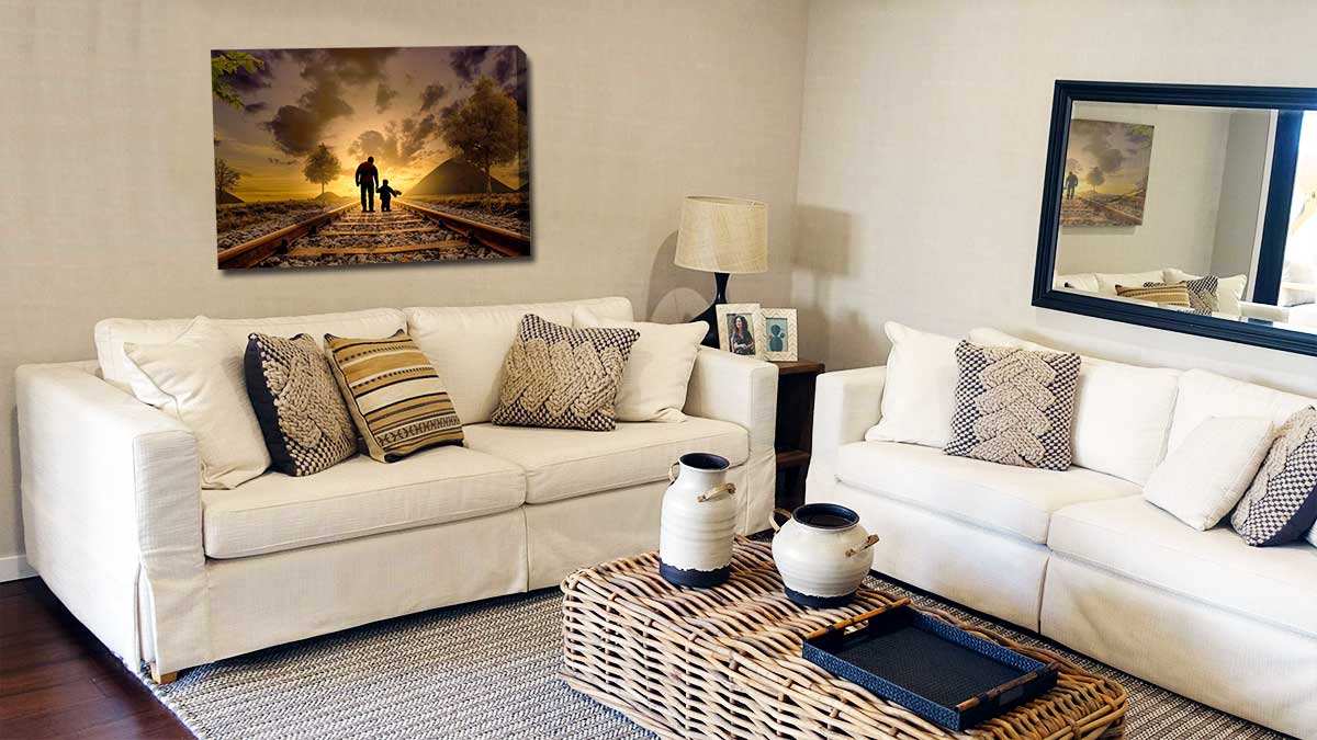 Photo of a father and son walking in the sunset on canvas hanging in a family sitting room