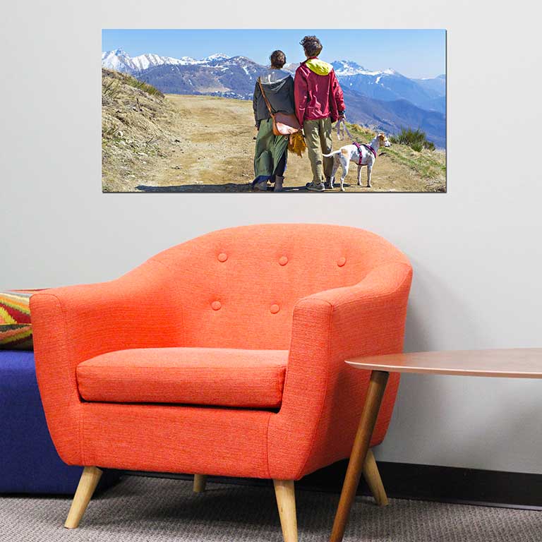 Panoramic photo print of a couple waking their dog within a picturesque mountain range