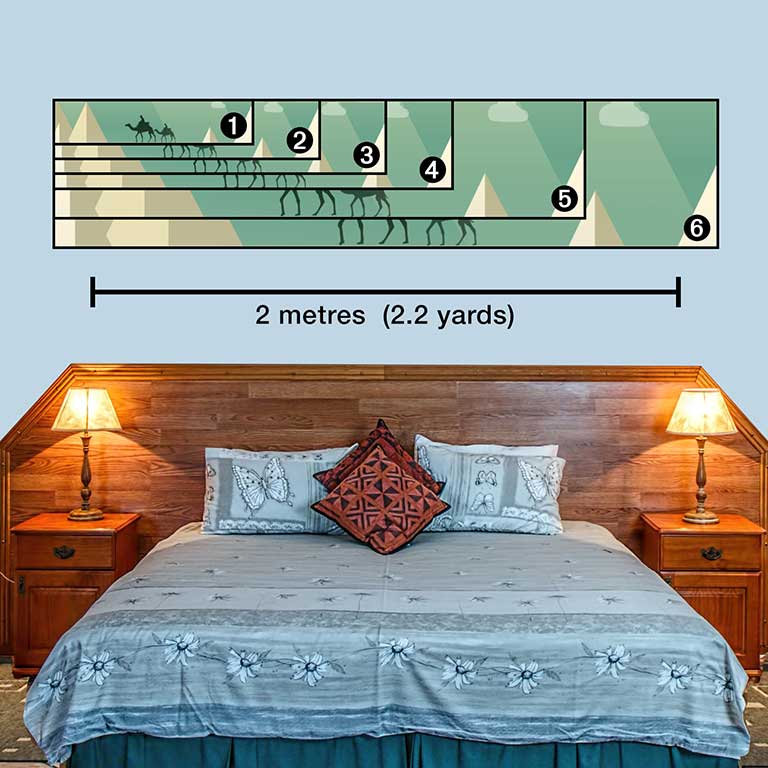 Panoramic holiday pic on a wall above a bed