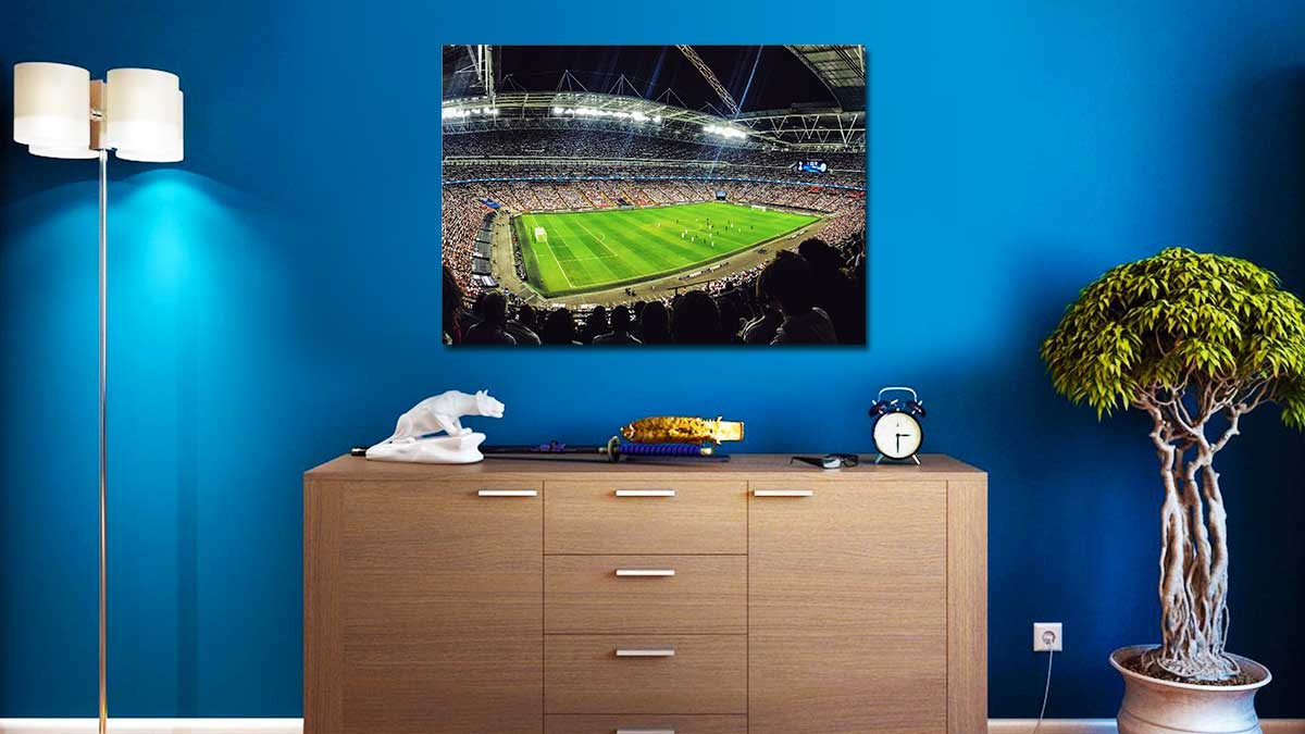 Large poster print showing a picture of a pet spaniel hung behind a cream settee