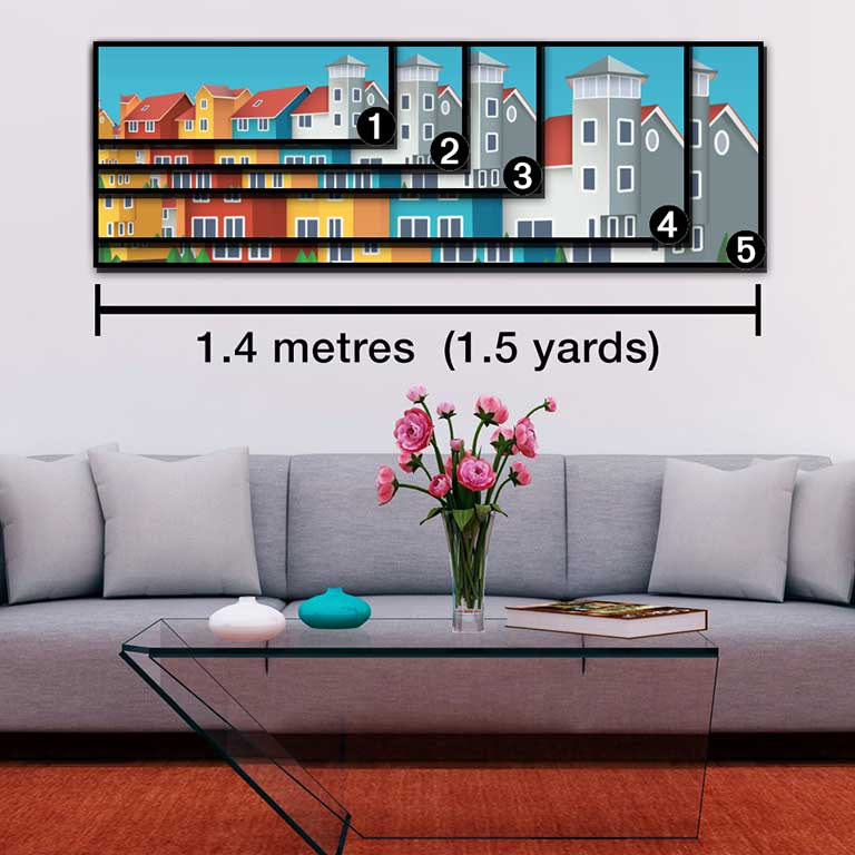 Decorated sitting room with a grey sofa and pink carnations