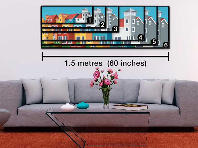 Decorated sitting room with a grey sofa and pink carnations